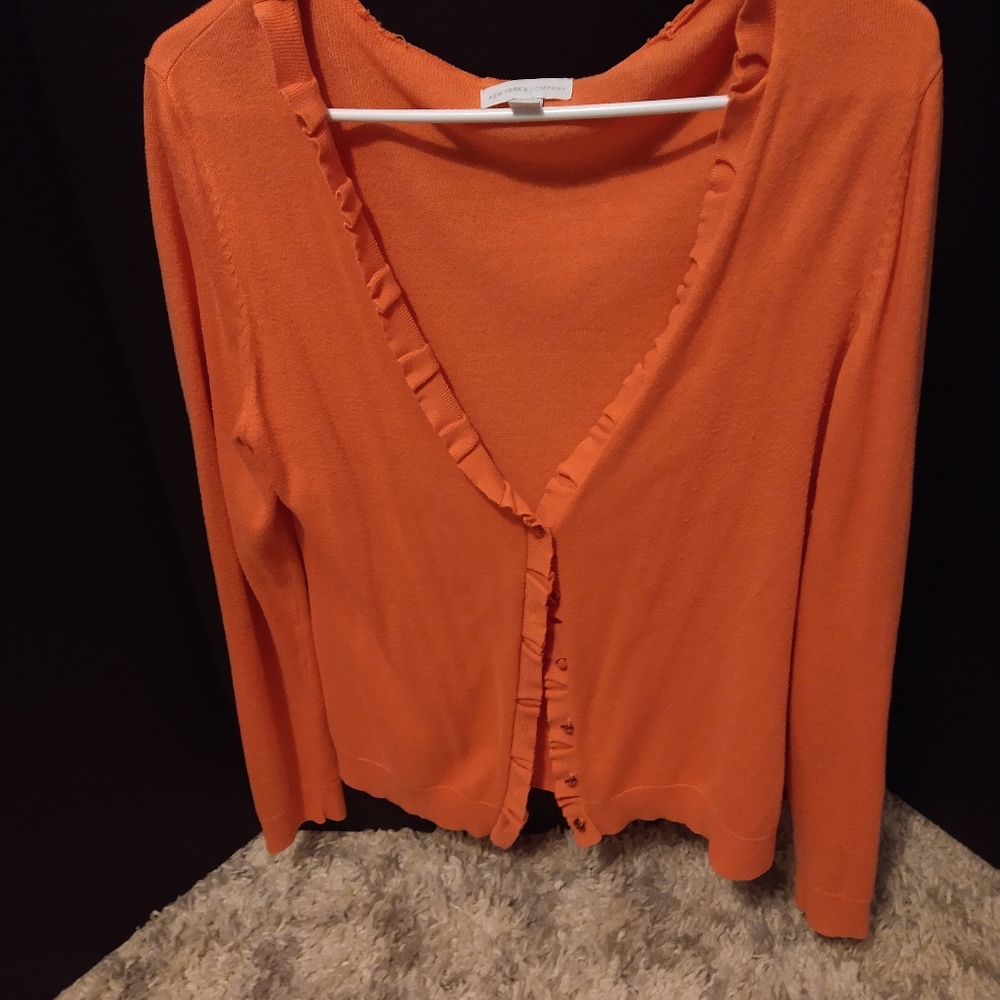 Salmon colored light weight sweater.